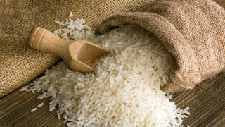 Sack of rice scoop on - wooden free wallpaper