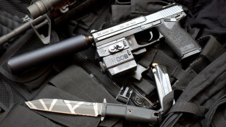Gun knife backpack city scene - a backpack free wallpaper