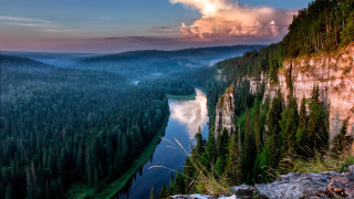River forest sunset mountain nature - a lush green forest under a cloudy sky free wallpaper