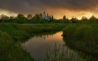River forest church evening magic - a lush green forest under a cloudy sky free wallpaper
