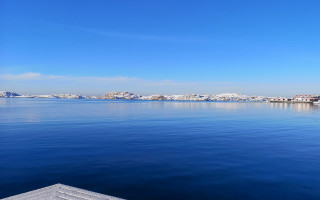 Calm lake snow mountains town - the distance in the distance free wallpaper