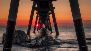 Pier red light rock sunset - the end of it free wallpaper