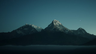 Mountain range starry sky night - a few cloud below free wallpaper