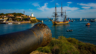 Harbor cannon lighthouse ship ocean - 8k artistic photography free wallpaper