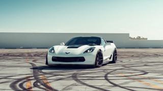 White sports car driving track - a sky background and a building in the background free wallpaper