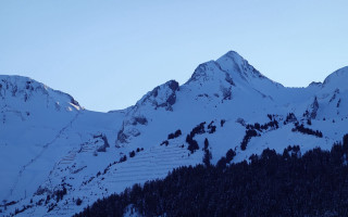 Snowy mountain ski lift night - a mountain free wallpaper