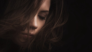 Woman blowing hair portrait dark - the wind free wallpaper for desktop