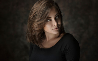 Woman black shirt black background 3 - free portrait wallpaper