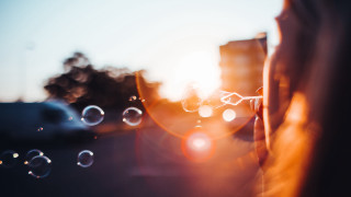 Person bubbles building sun lens - abstract illusionism free wallpaper