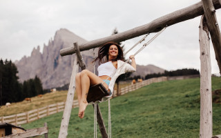 Woman swing field mountains fence - in the foreground free wallpaper