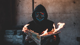 Black hoodie newspaper flames neon - dystopian art free wallpaper