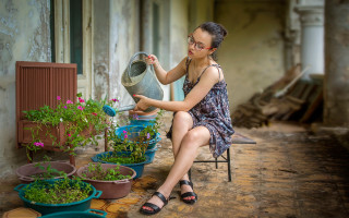 Woman sitting plant watering can - the other hand free wallpaper