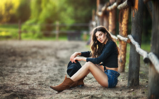Woman sitting fence cowboyboots blackshirt - the ground next free wallpaper