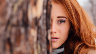 Woman red hair portraits blurry - a wooden door free wallpaper