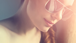 Woman glasses braid looking down - glass free wallpaper