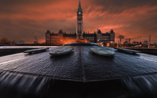 Cityscape tower sunset clouds river - a large building free wallpaper