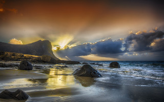 Beach rocks water cloudy sky 15 - crepuscular ray free wallpaper