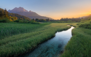 River green field mountain sunset - a sun setting free wallpaper