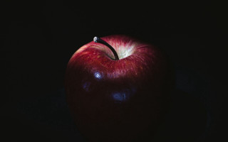 Red apple black background caravaggio - a red apple free wallpaper