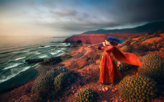 Woman red dress cliff ocean - a red cape free wallpaper