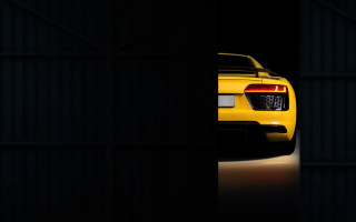 Yellow sports car dark doorway - rim free wallpaper