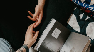 Person holding book bed blankets - graphic novel free wallpaper