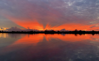 Sunset lake reflection trees clouds 2 - a sunset over a lake free wallpaper