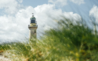 Lighthouse hill cloudy sky green - a lighthouse free wallpaper