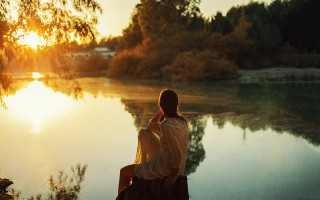 Man sitting lake sunset autumn - impressionist free wallpaper