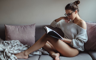Woman sitting couch reading blanket - hard free wallpaper