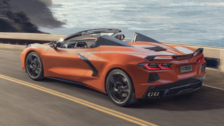 Orange sports car ocean cliffs - side profile free wallpaper