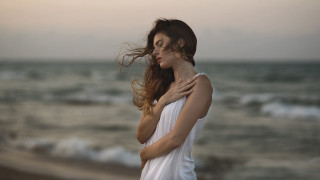 Woman beach wind sunset portrait - a sunset free wallpaper