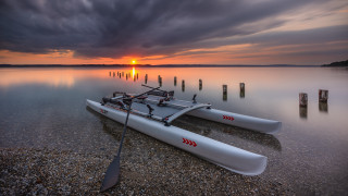 Kayak shore lake sunset cloudy - a few pole free wallpaper