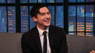 Man suit tie couch smiling - someone free wallpaper