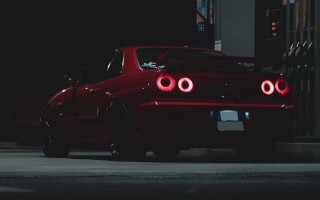 Red car headlights parking night - a red car free wallpaper