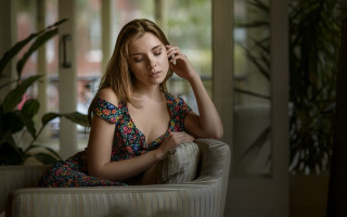 Woman sitting couch phone window - a cell phone in a room free wallpaper