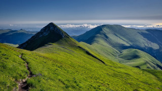 Grassy mountain trail clouds nature - a trail free wallpaper