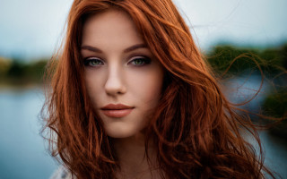 Woman red hair blue eyes 6 - a blue sky in the background free wallpaper for desktop