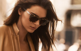 Woman sunglasses tan jacket street - dave kendall free wallpaper