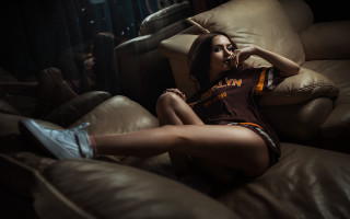 Woman sitting couch basketball shoe - a couch free wallpaper