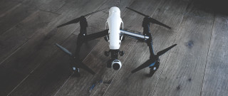 Remote controlled black white drone - product photo free wallpaper