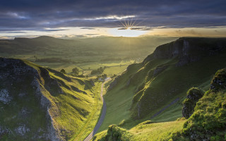 Scenic valley road sun mountains - a scenic view of a valley free wallpaper