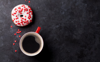 Coffee donut red sprinkles black - a black surface free wallpaper
