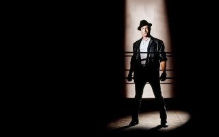 Man dark hat jacket standing - arnold mesches free wallpaper