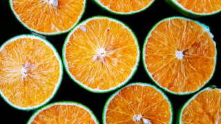 Oranges halved table top black - a group of oranges free wallpaper