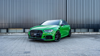 Green car building metal wall - a black car free wallpaper