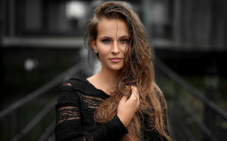 Woman longhair building fence bokeh - flowing hair free wallpaper