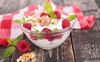 Yogurt raspberries granola wooden table - a wooden table free wallpaper