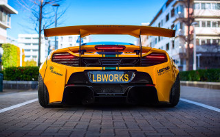 Yellow sports car brick road - andrew law free wallpaper