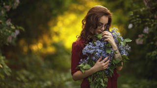 Woman flowers serious bokeh outdoors - a woman holding free wallpaper